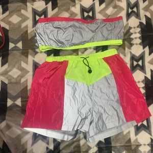 Two piece reflective shorts and tube top set.